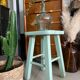 Old almond green wooden stool