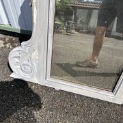 Large decorative mirror in carved wood with shabby patina