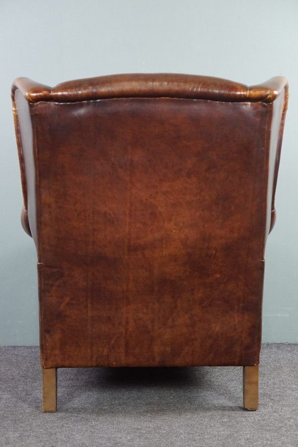 Armchair in patinated sheepskin leather