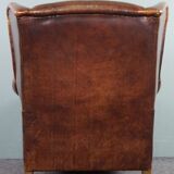 Armchair in patinated sheepskin leather