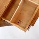 1960s wooden sewing cabinet with double-sided drawers