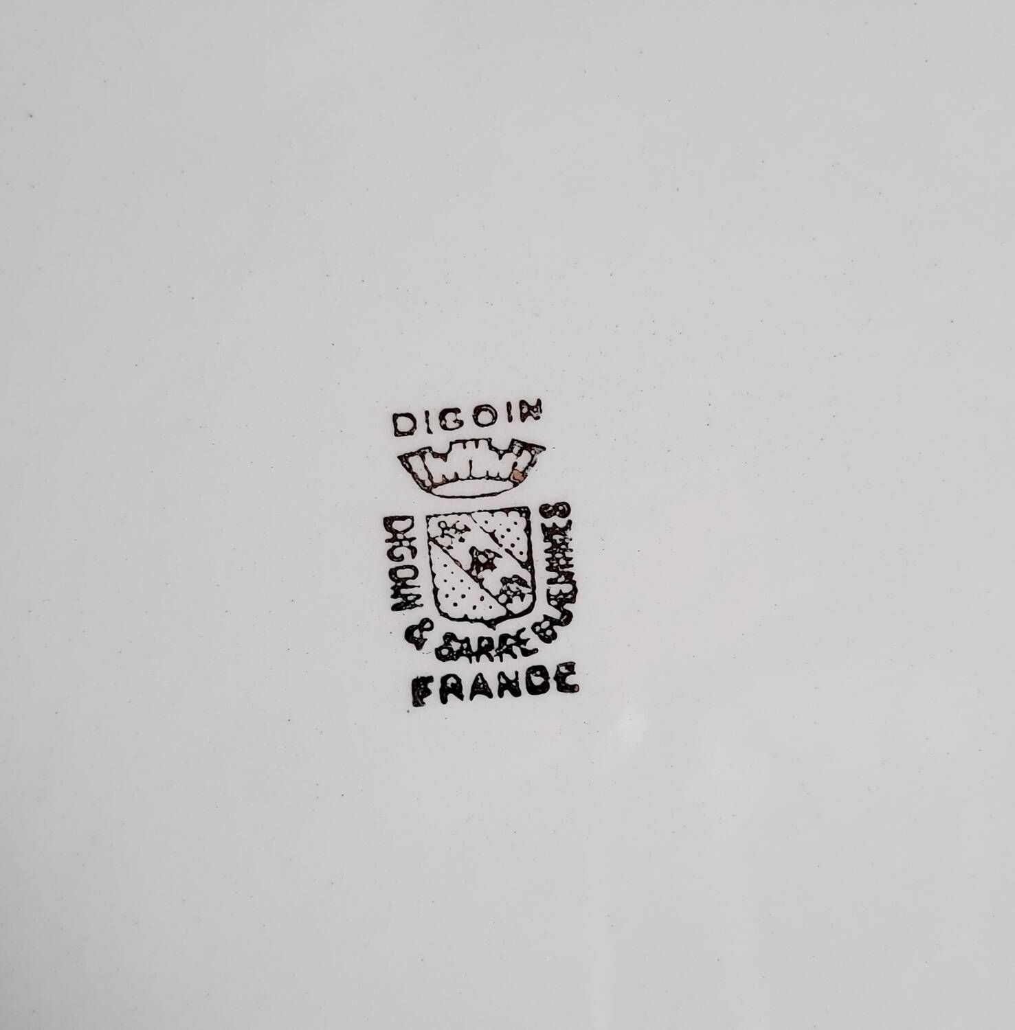 Old mismatched earthenware dessert plates with gold accompanied by a dish