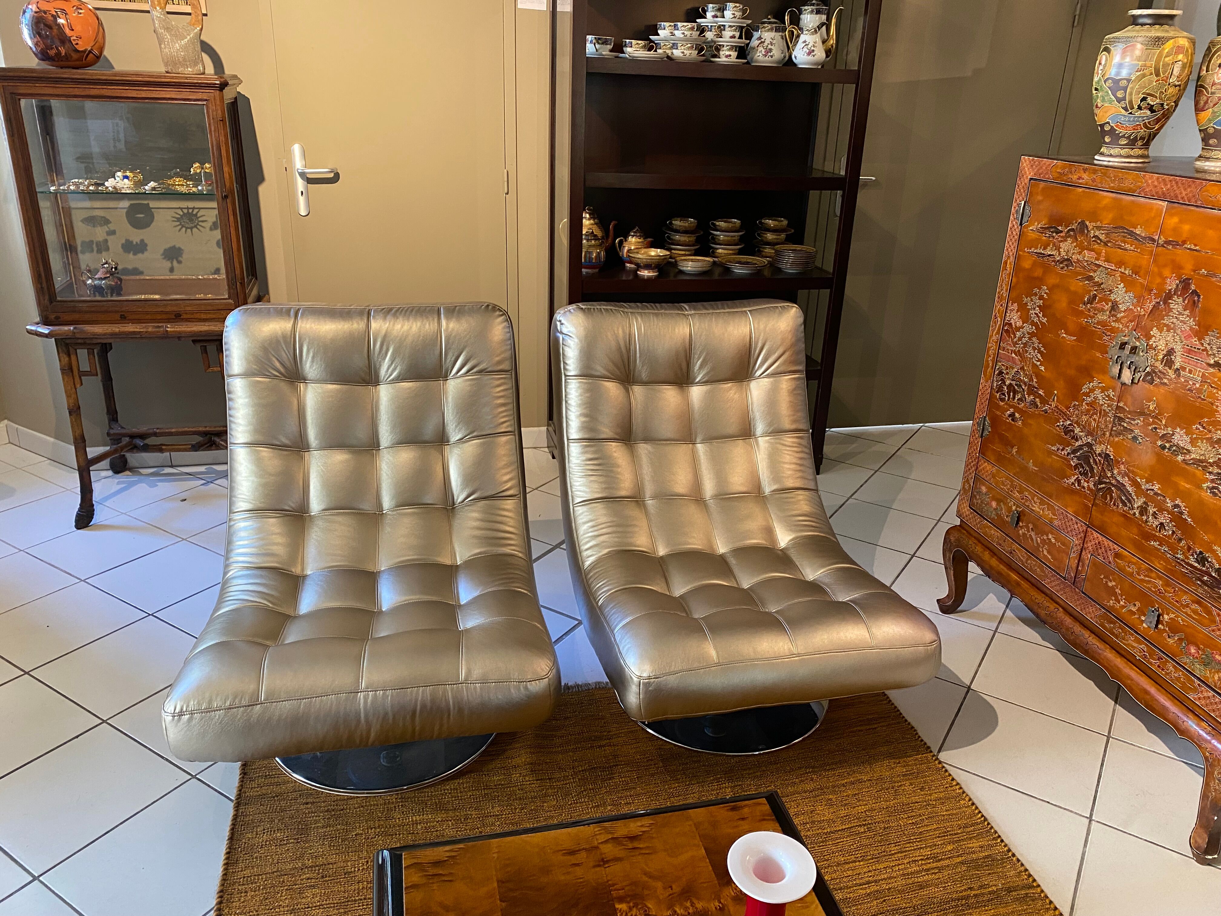 Pair of leather design armchairs