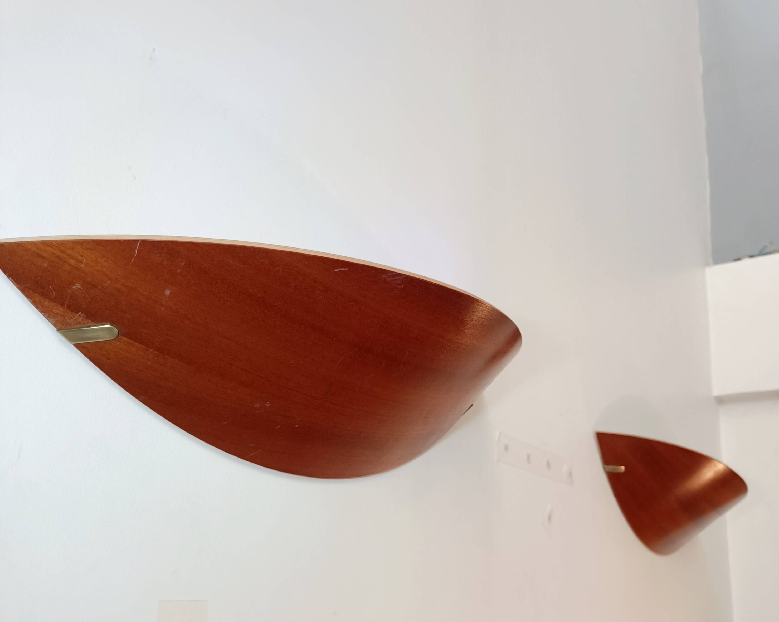 Large wooden and brass wall lights by Declic France, 1980s.