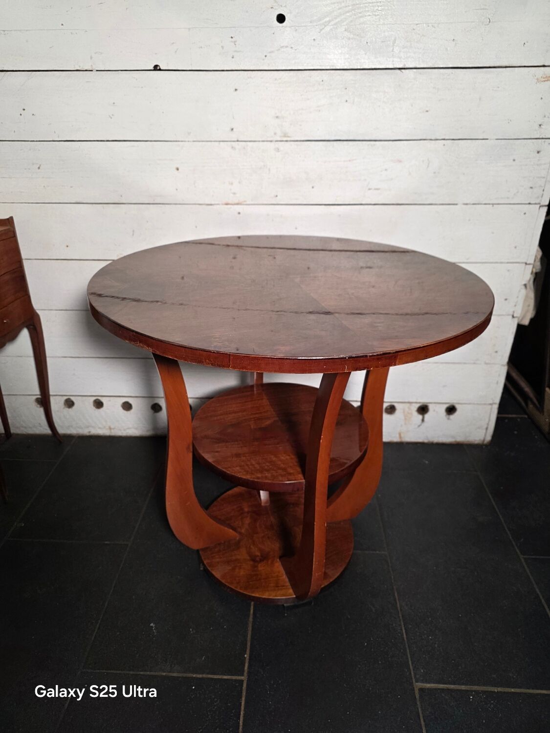 Art Deco walnut gueridon with double top from the 1930s.