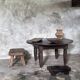 Antique round coffee table in Indonesian teak with turned legs.