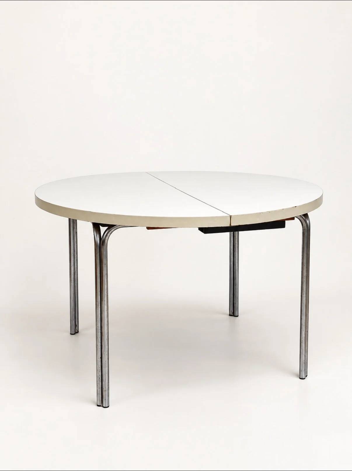 Vintage round extendable dining table, white laminate on chrome legs.