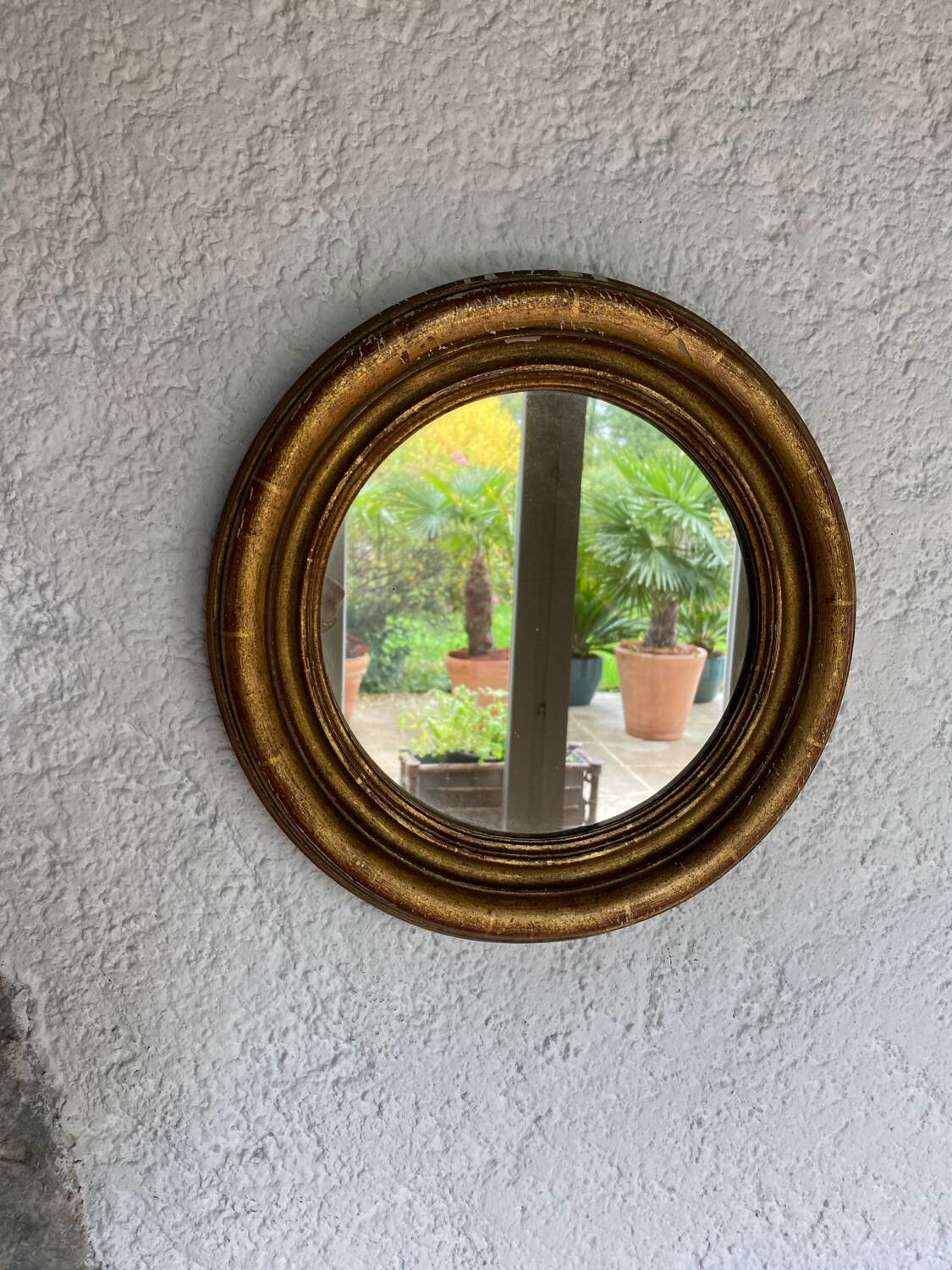 Miroir rond en bois doré ancien