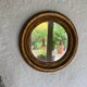 Miroir rond en bois doré ancien