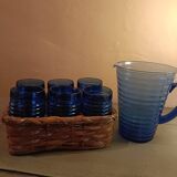 Orangeade carafe service and 6 glasses in a wicker basket