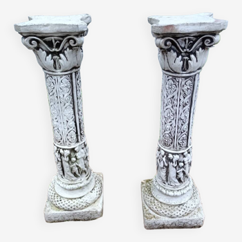 Pair of old stone columns with antique decor
