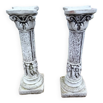 Pair of old stone columns with antique decor