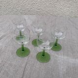 5 transparent glass glasses and green glass vase go