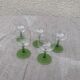5 transparent glass glasses and green glass vase go