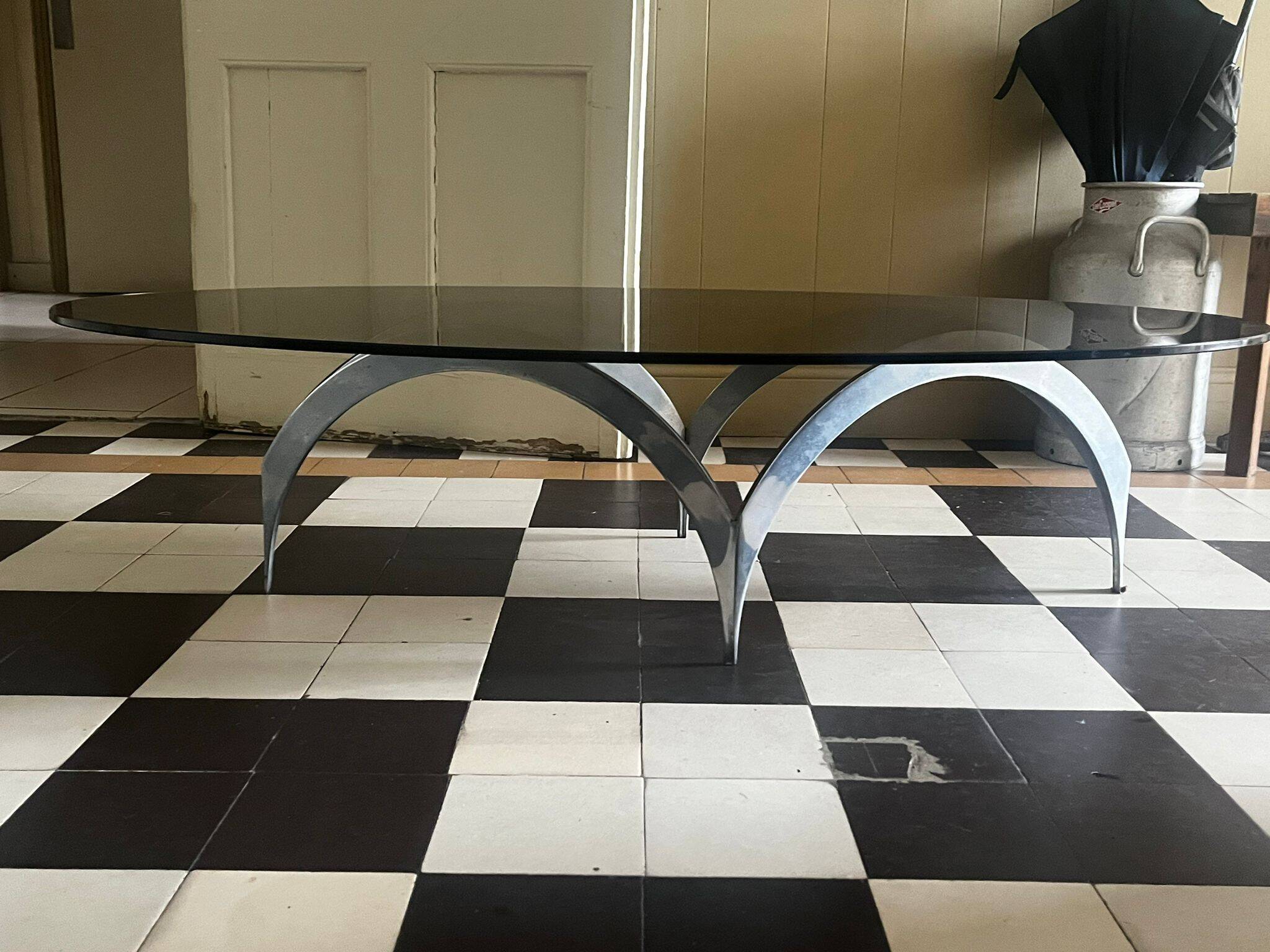 coffee table with metal legs and smoked glass top