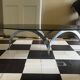 coffee table with metal legs and smoked glass top