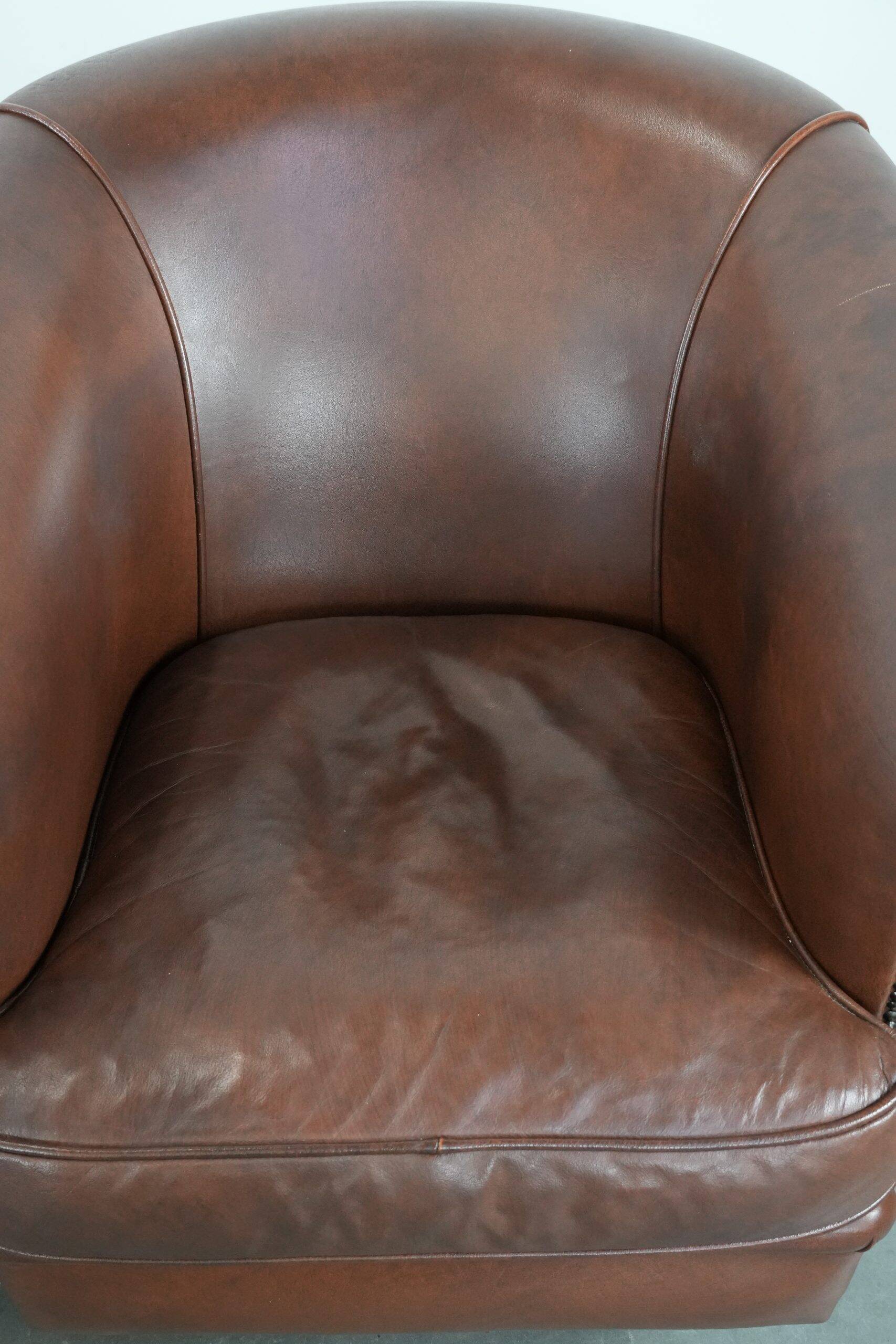 Unique set of two cognac-coloured cow leather club armchairs