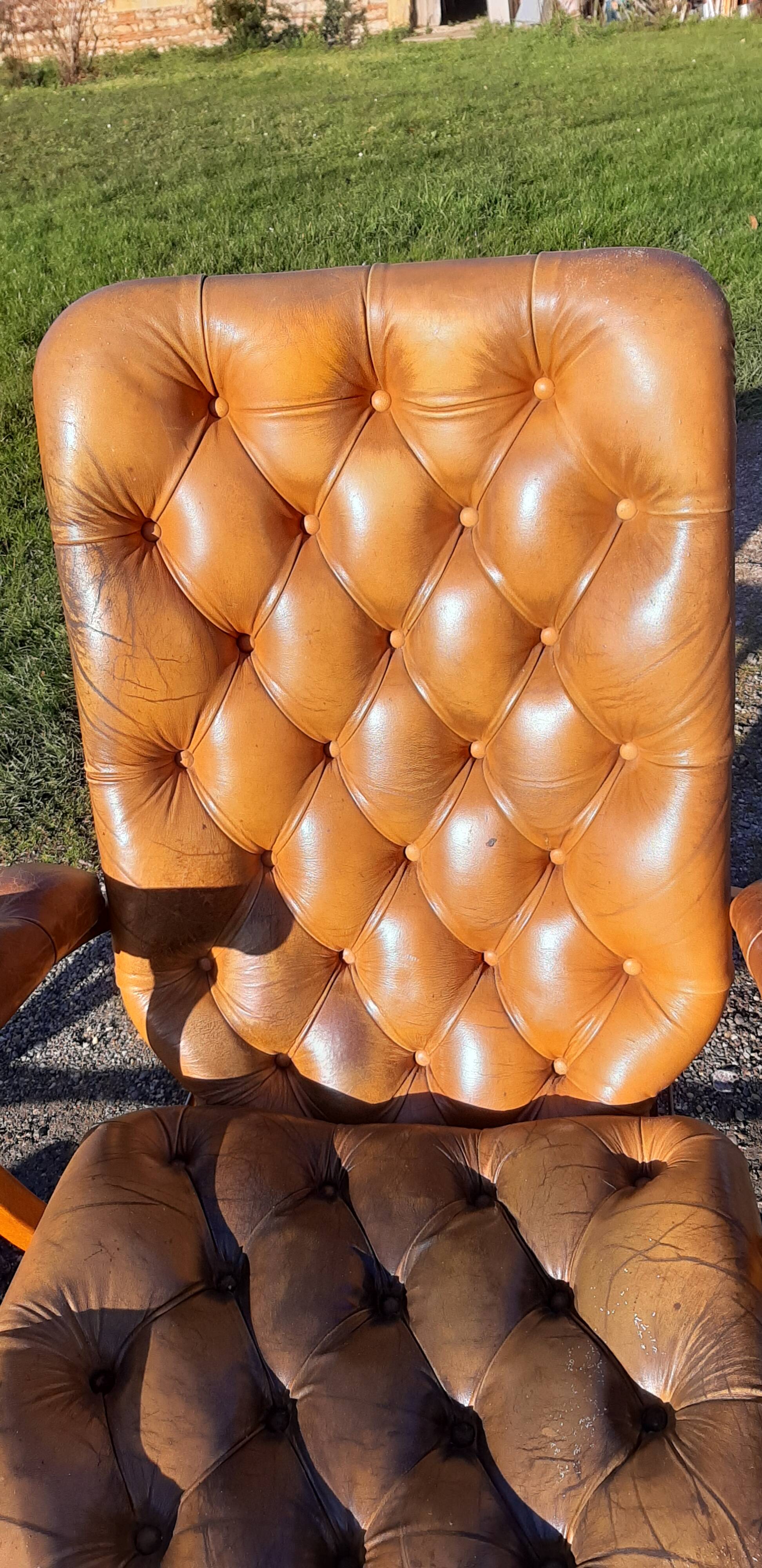 Pair of chesterfield style leather armchairs