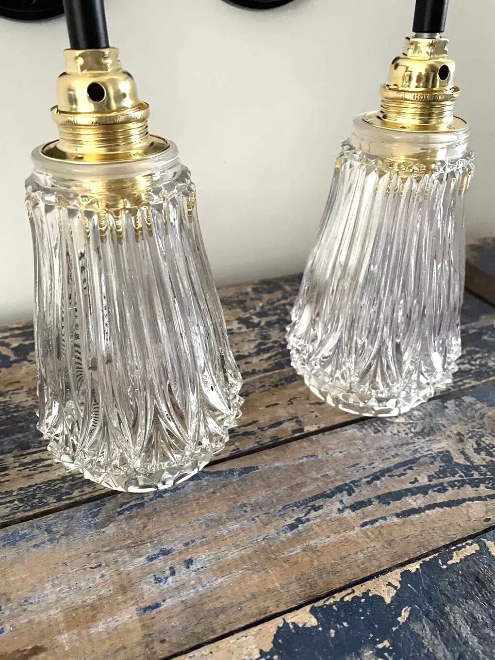 Set of two electrified chiseled glass sconces to nine