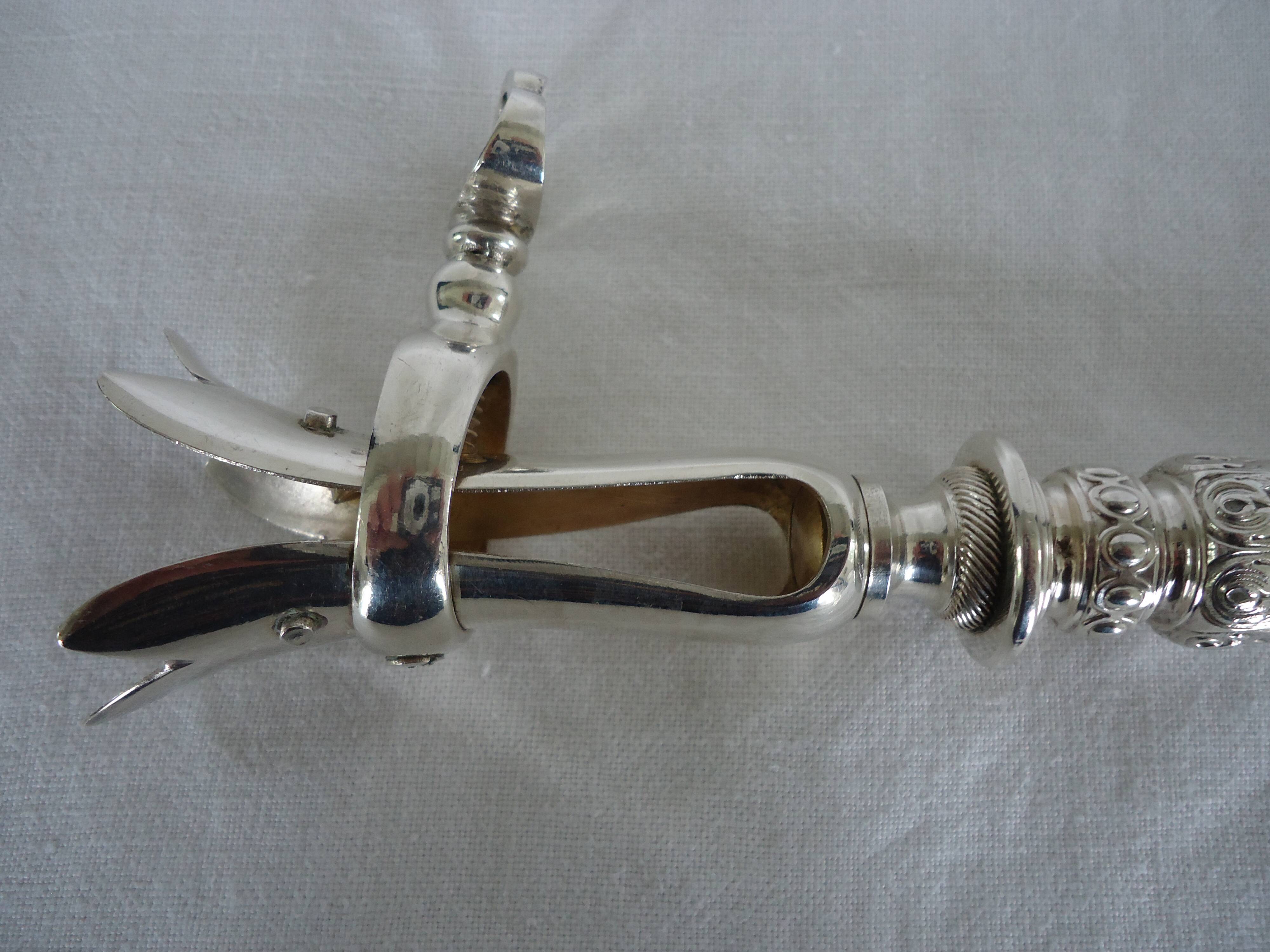 Leg of lamb handle, silver metal tongs and lined silver handle