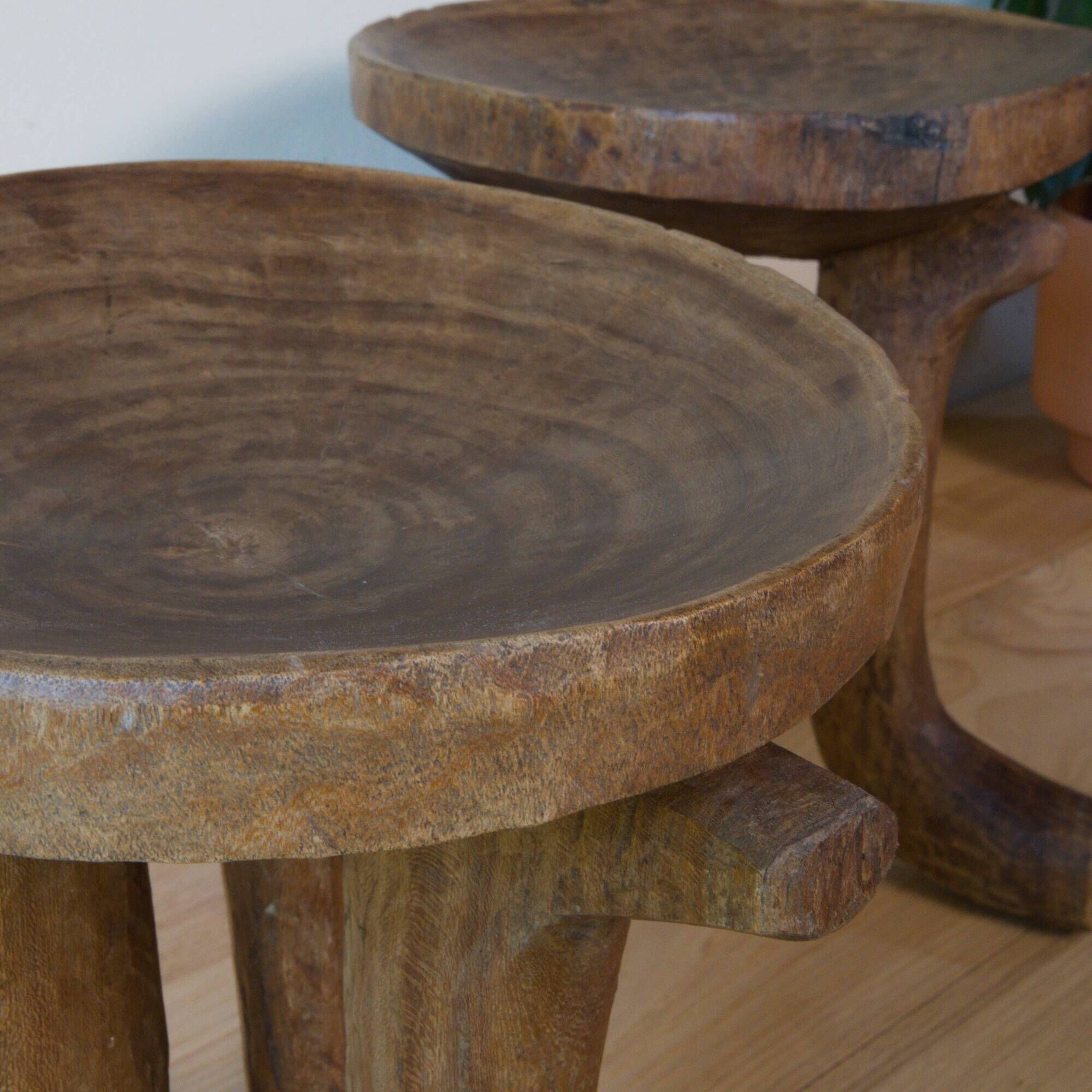 Pair of ancient Ethiopian tripod stools made of monoxyle wood.