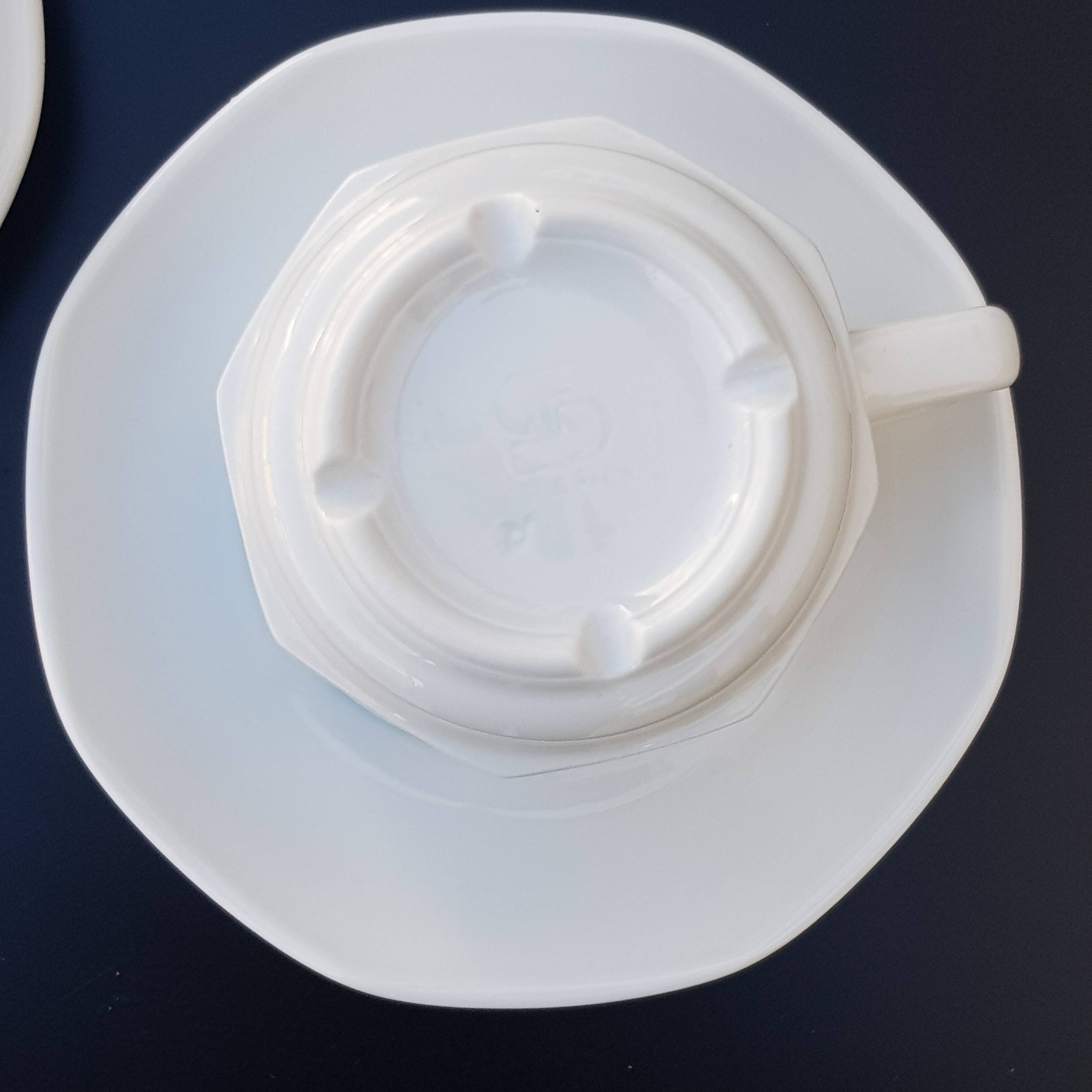 4 White cups and saucers
