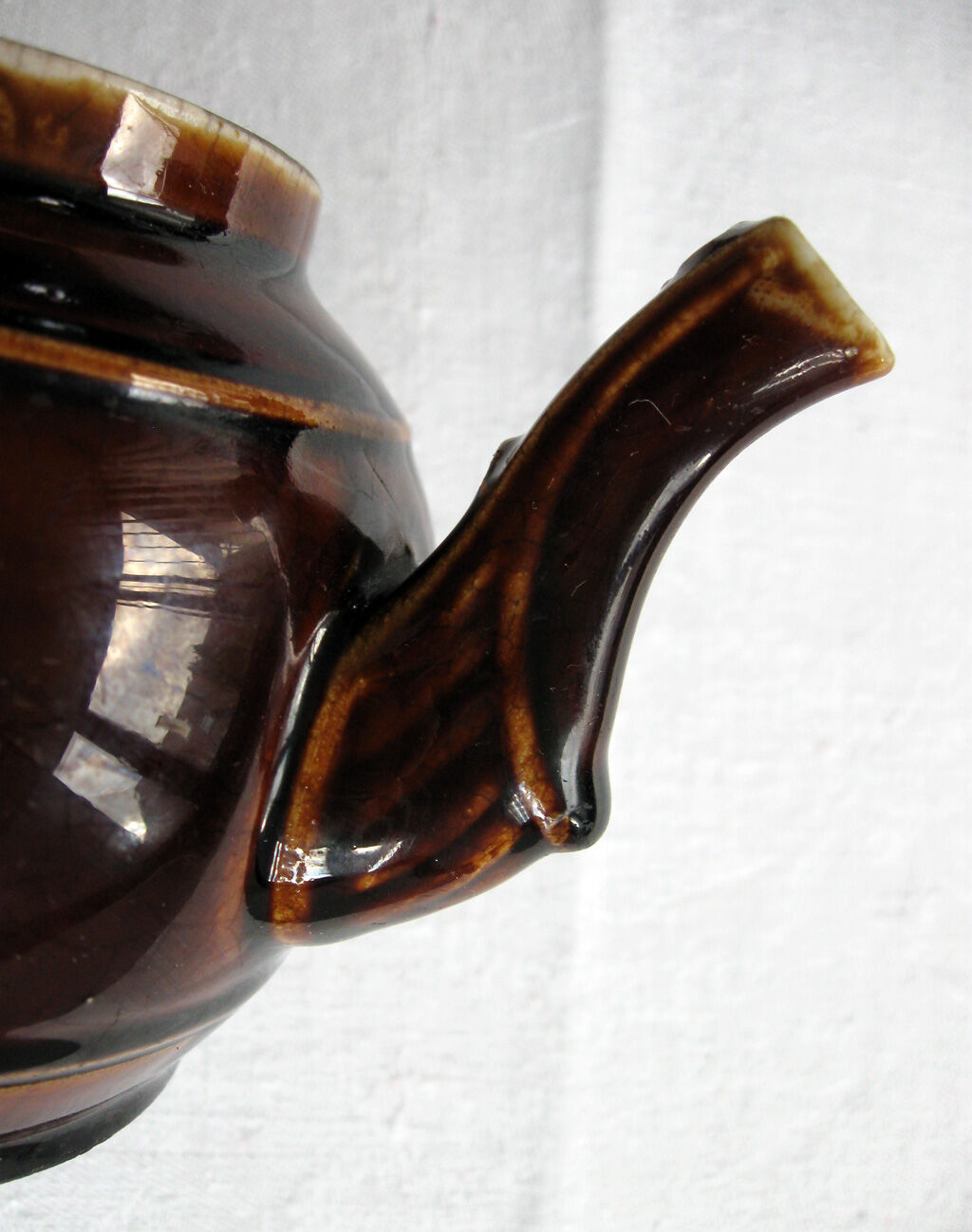 Old brown glazed ceramic coffee pot