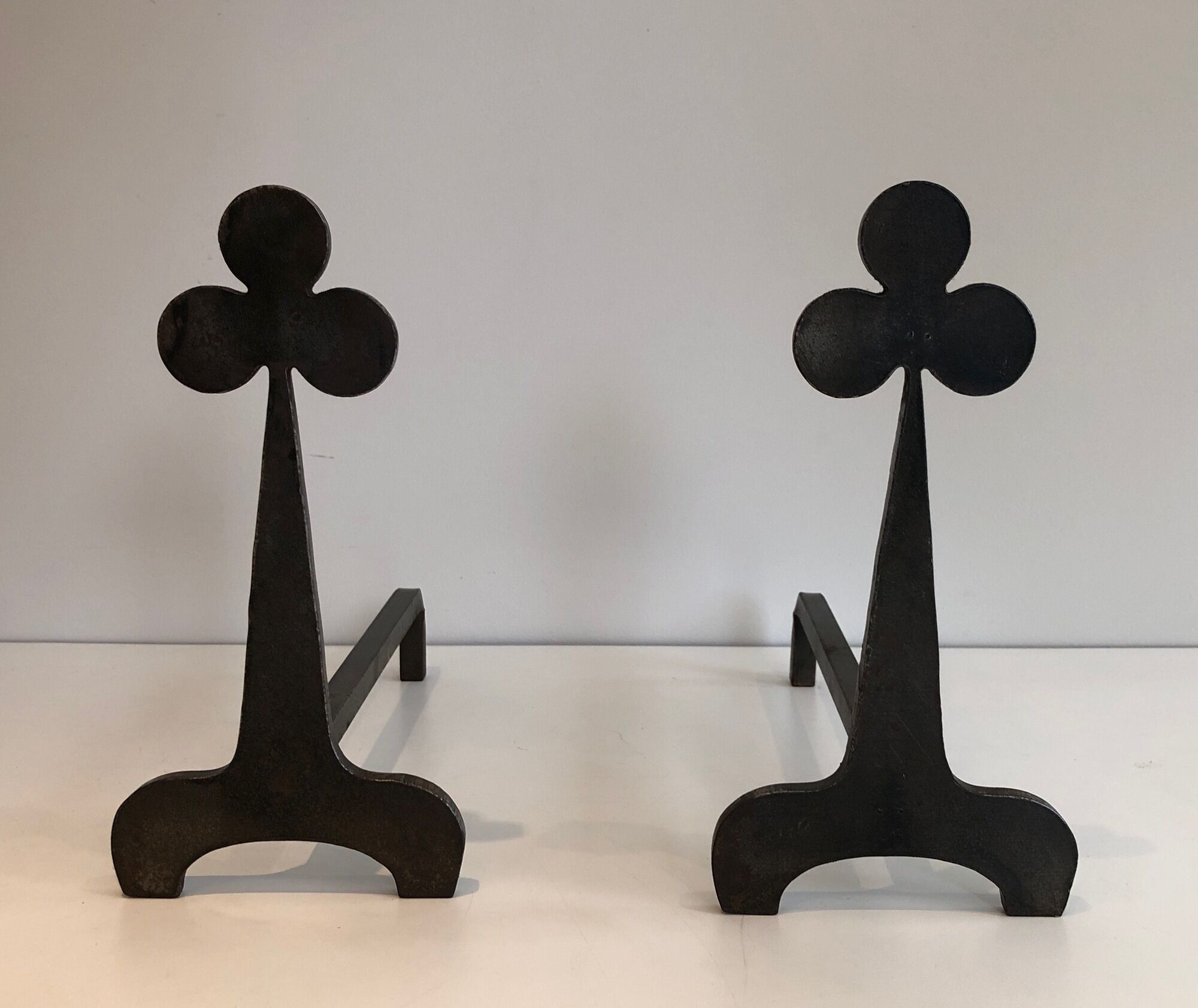 Pair of wrought steel and iron chenets with clover decorations 1950