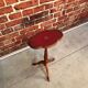 Wooden pedestal table red leather top