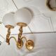 2 classic golden cherub wall lights and globe lampshades in perfect condition.