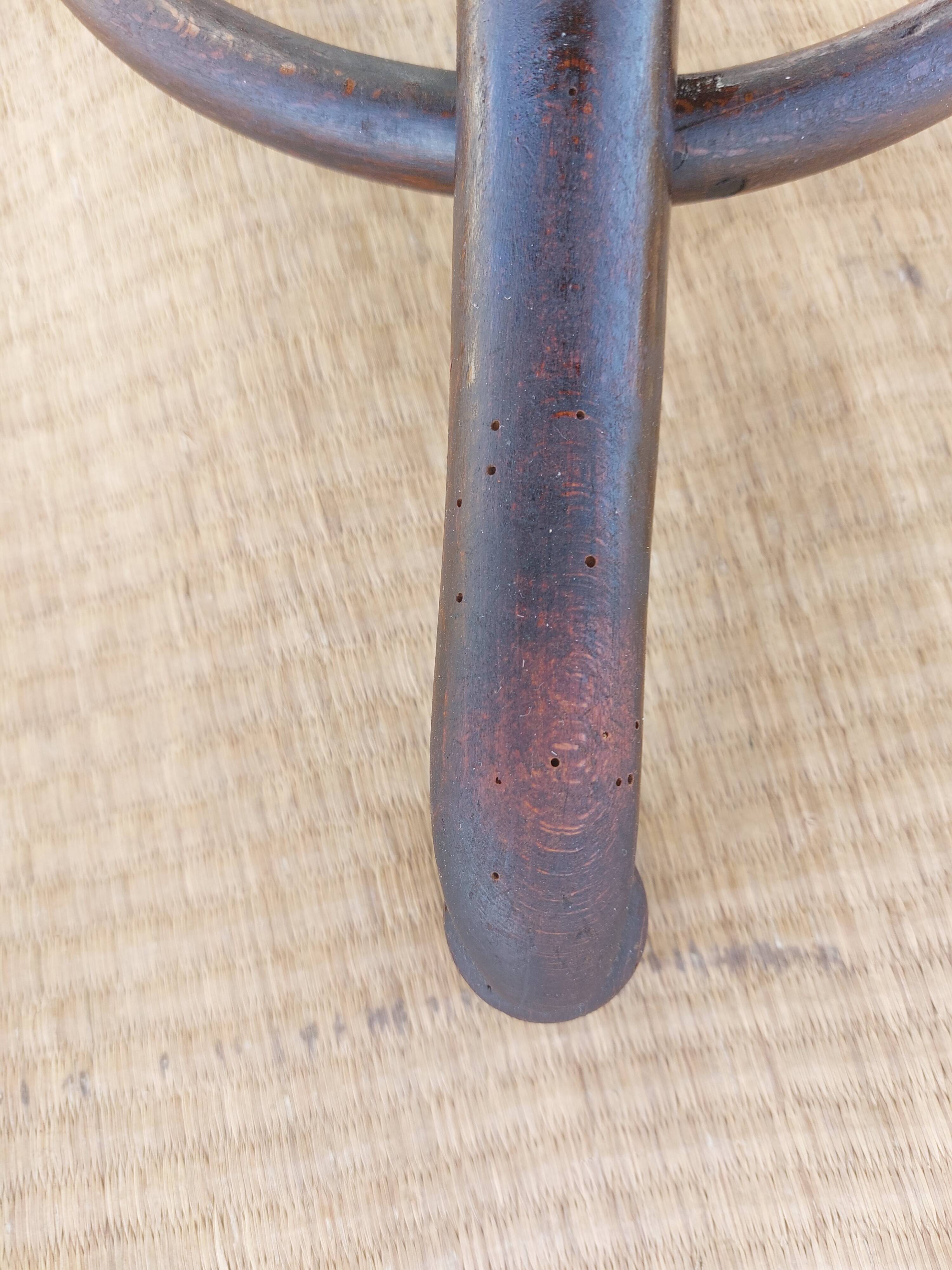 Swivel wooden armchair, pattern on seat