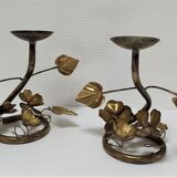 Pair of brass candle holders decorated with patinated metal flowers