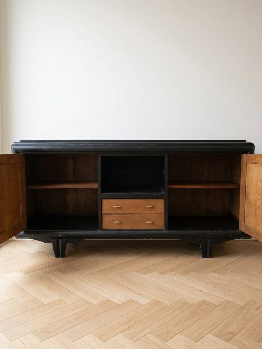 Buffet in Art Deco style made of blackened wood and carved oak.