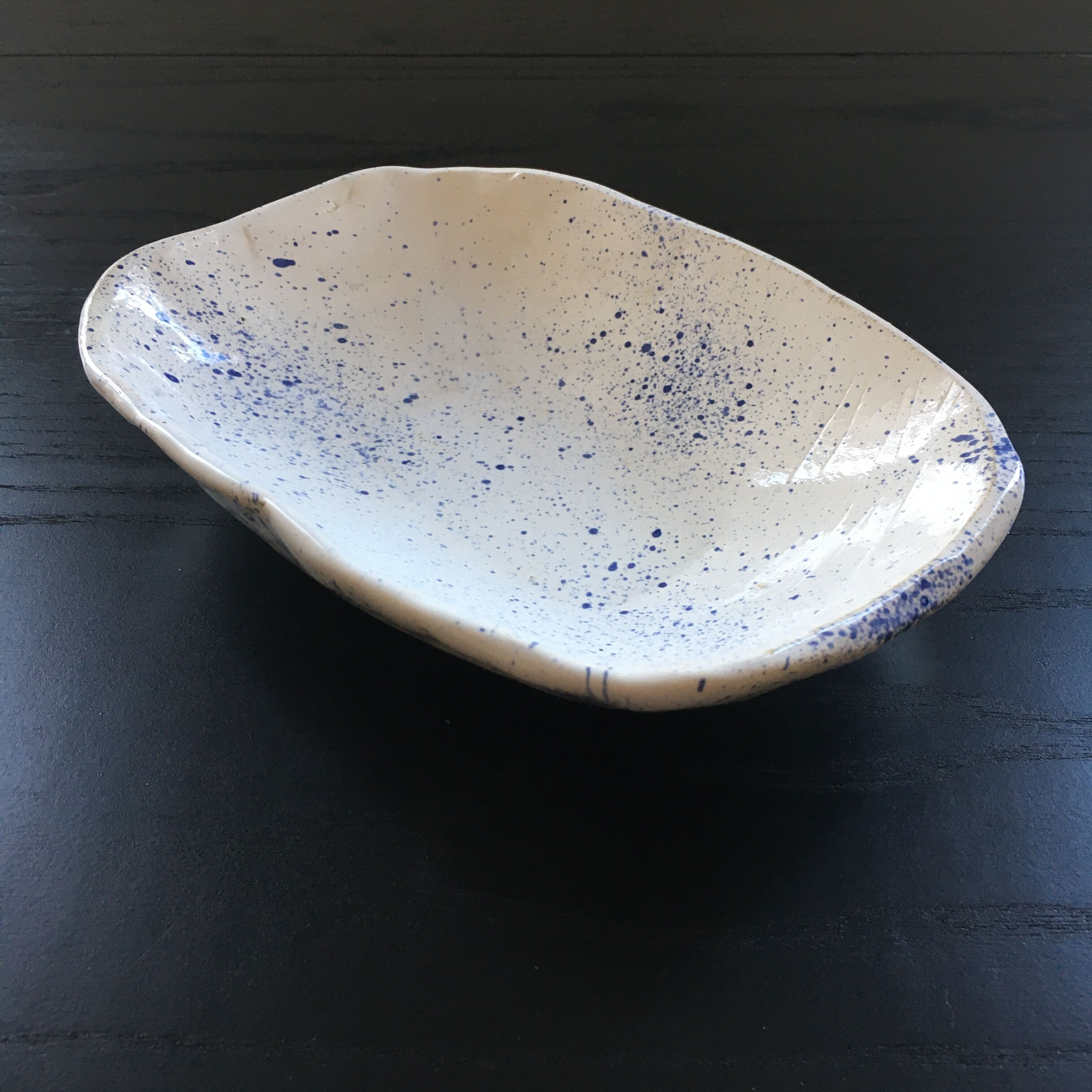 Empty blue speckled white pocket