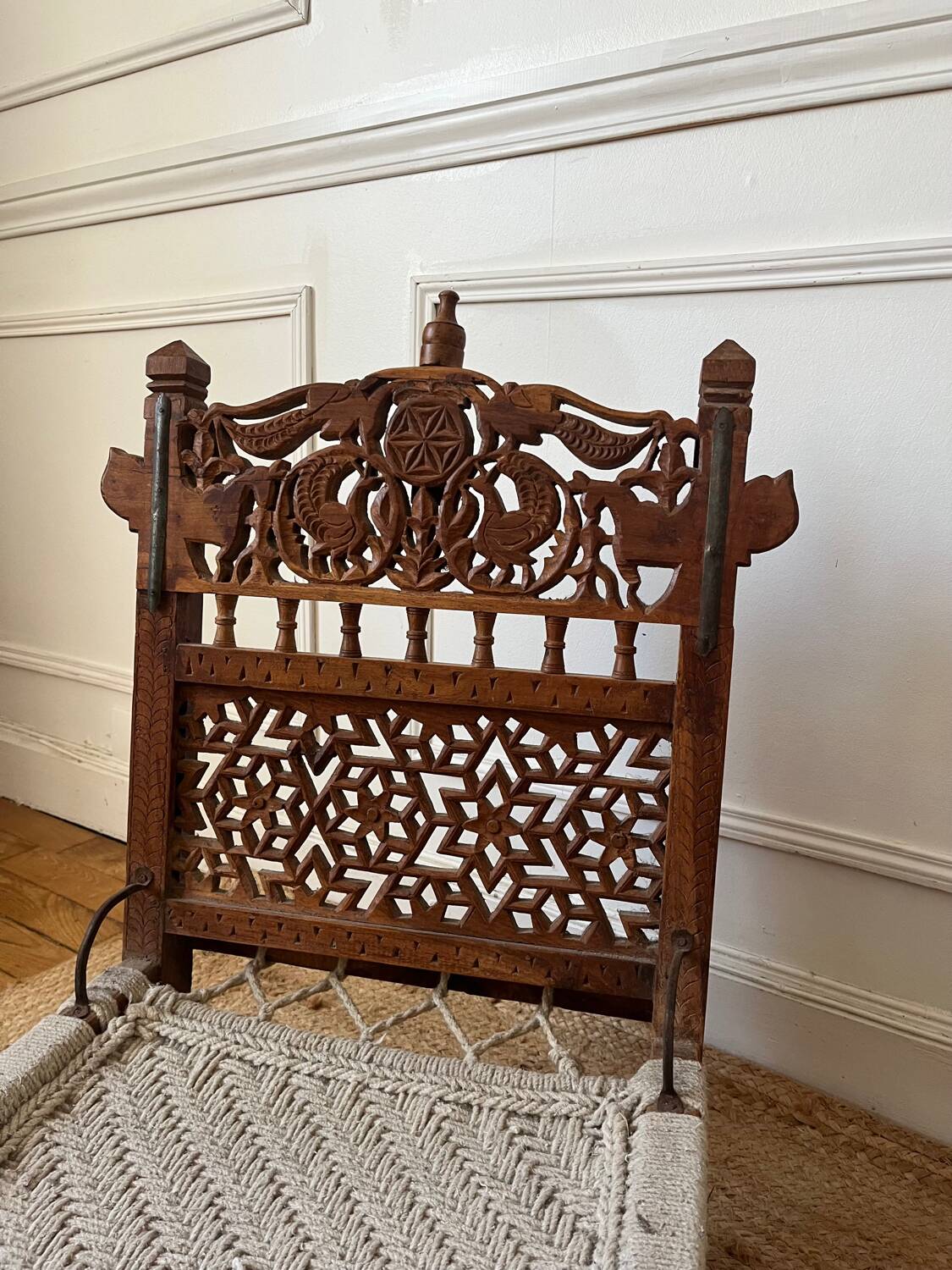 Pair of traditional Indian chairs made of carved wood and rope