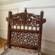 Pair of traditional Indian chairs made of carved wood and rope