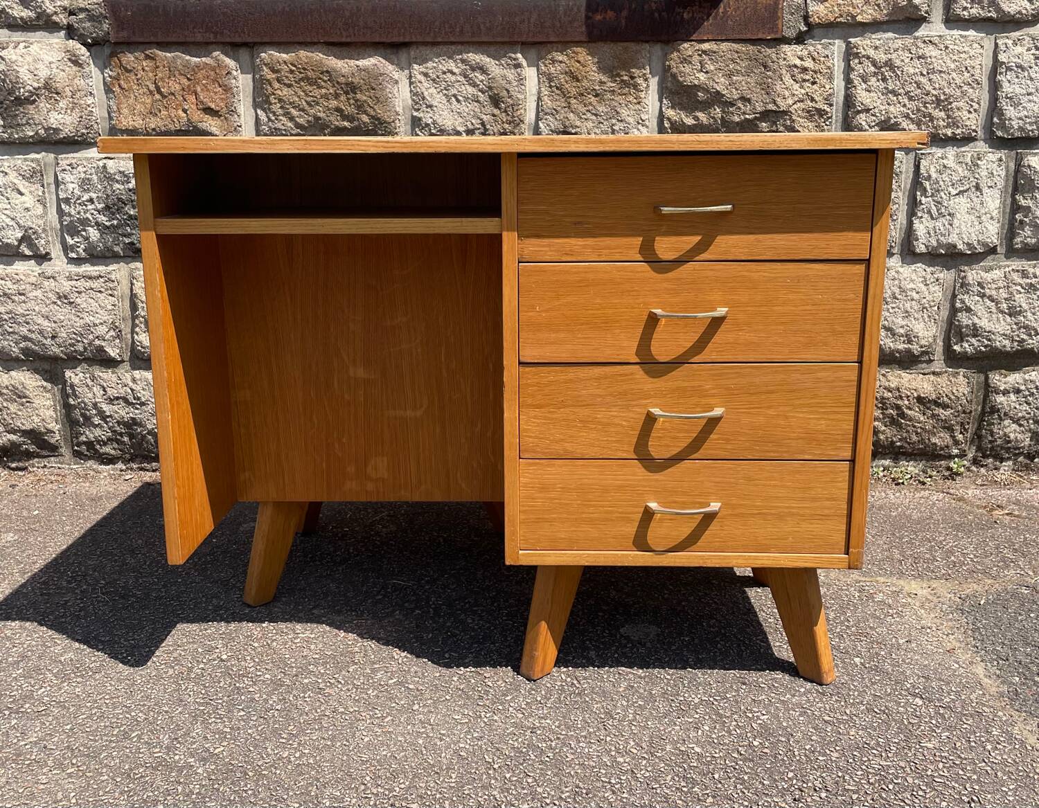 Double-sided desk with compass legs.