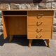 Double-sided desk with compass legs