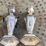 Pair of metal candlesticks, chiseled with a statuette in front, rose pattern in relief, art deco