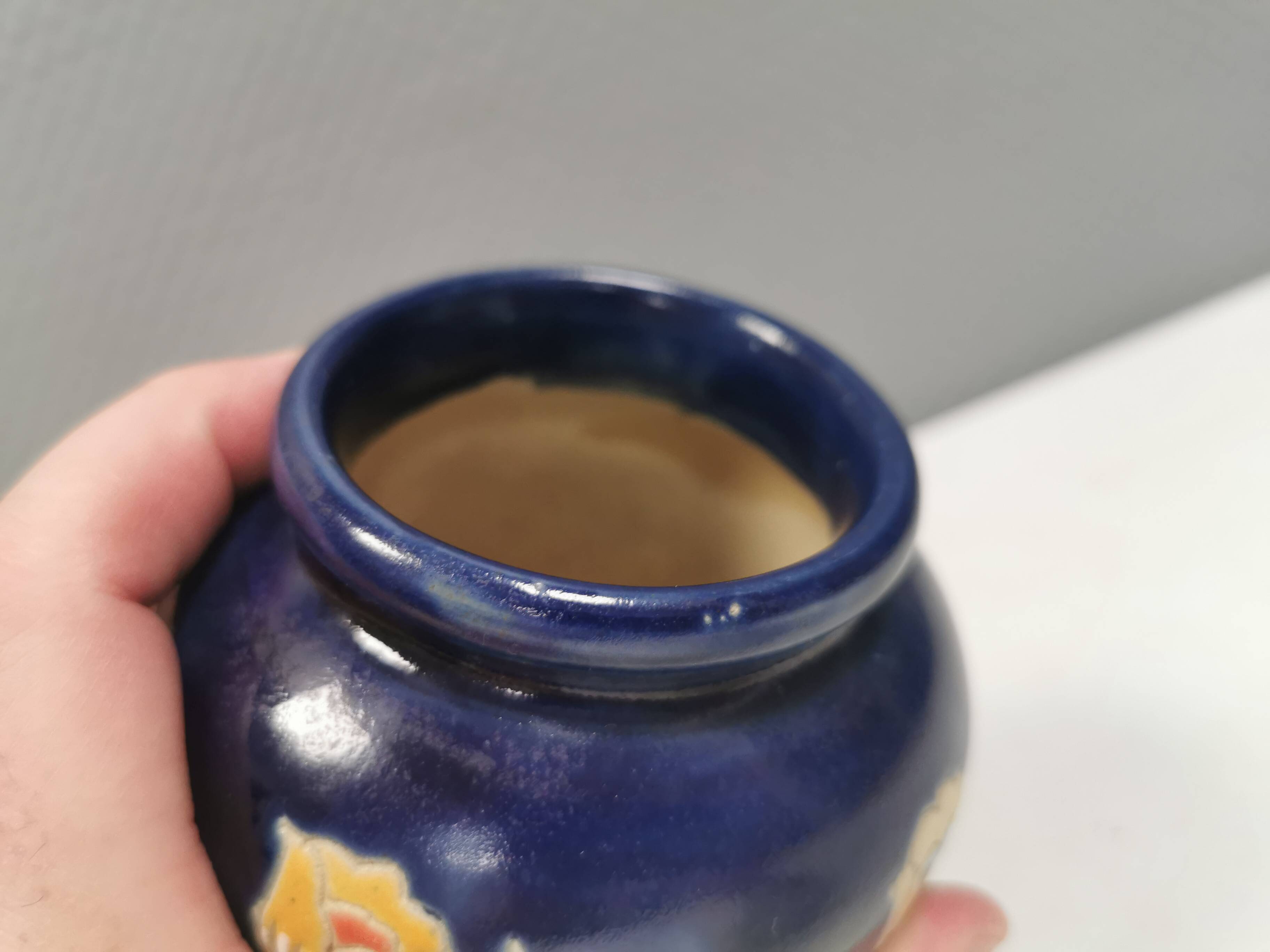 Small delicious blue ceramic vase with floral decoration. Sweden 1970s