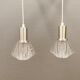 A set of smaller hanging lamps, in hard pressed glass, with metal top