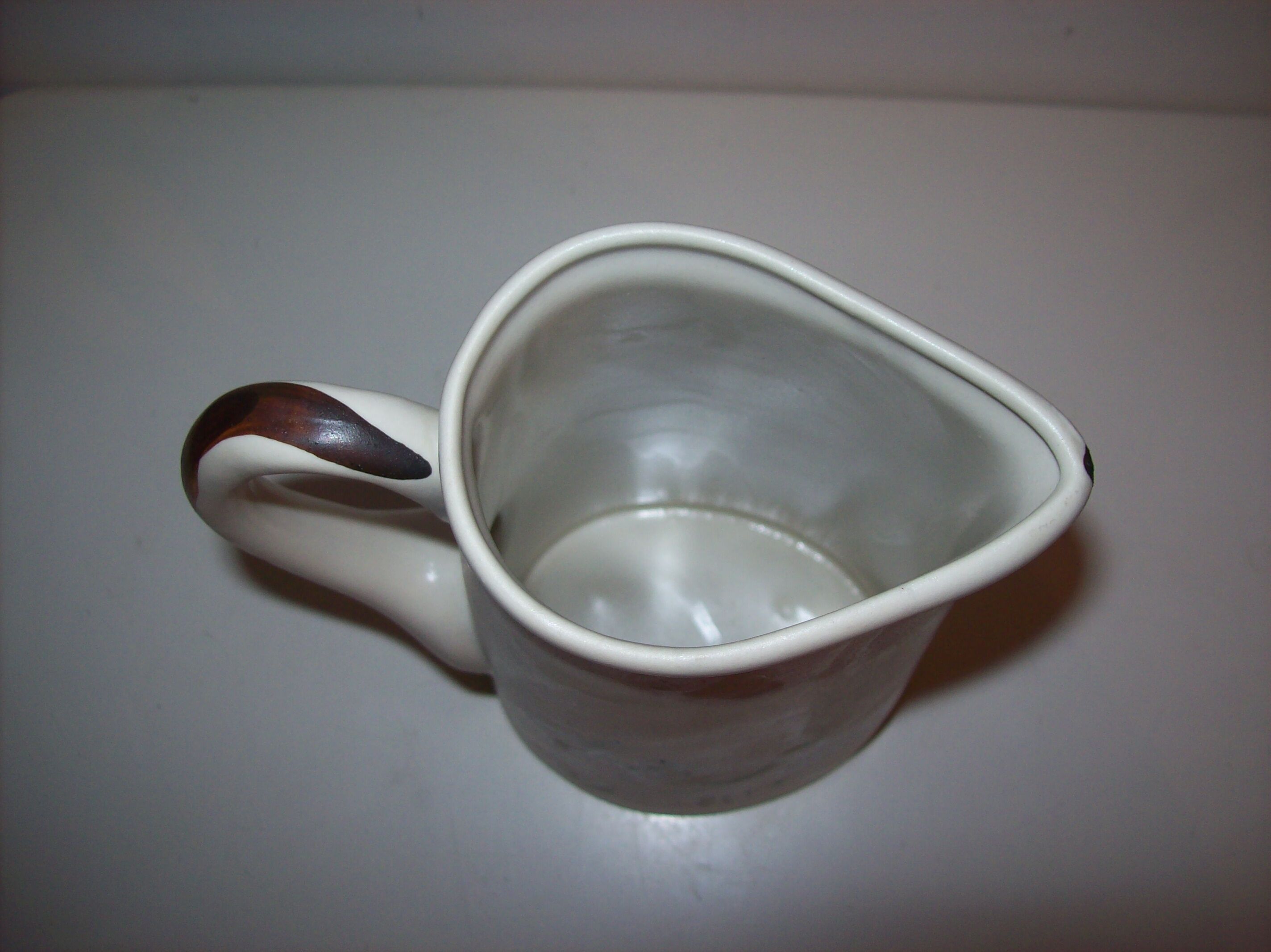 Ceramic pitcher with hand-painted decoration