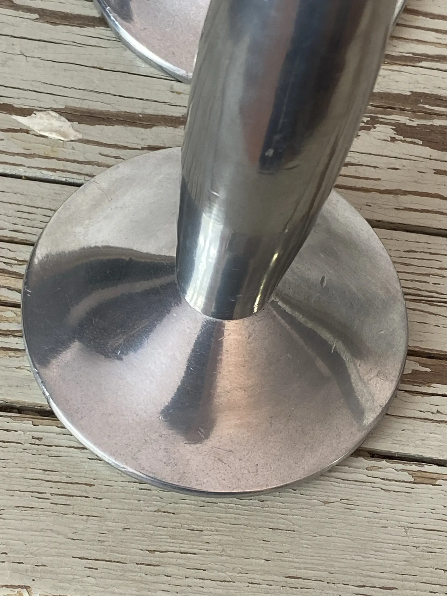 Pair of minimalist polished aluminium candle holders