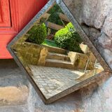 Art Deco mirror in chiseled wrought iron with beveled glass