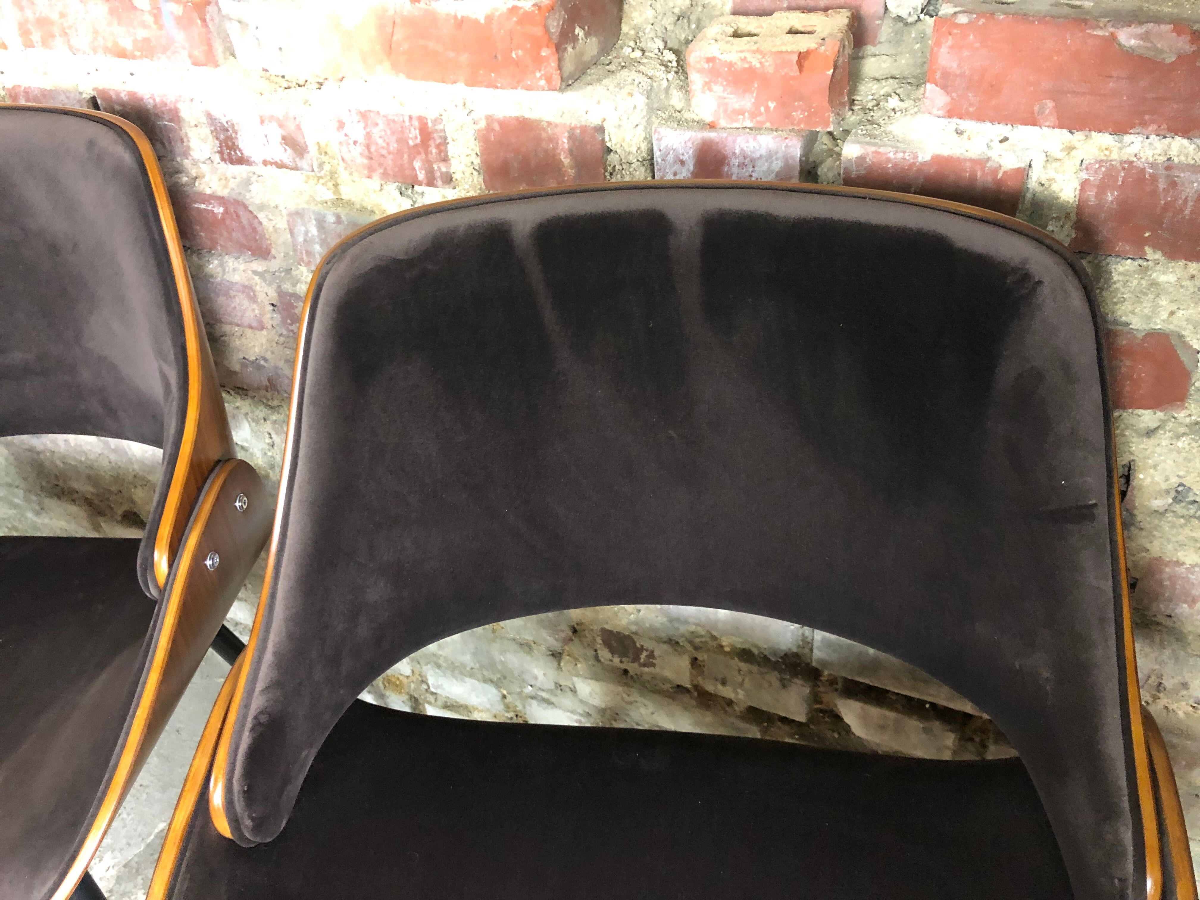 Scandinavian style chairs in curved plywood covered with brown fabric