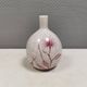 A vase in crackled porcelain with pink decoration. Germany 1930s