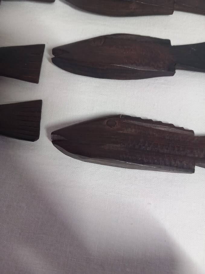 Antique wooden knife rests.
