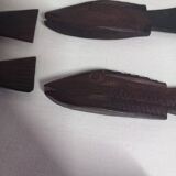 Antique wooden knife rests.
