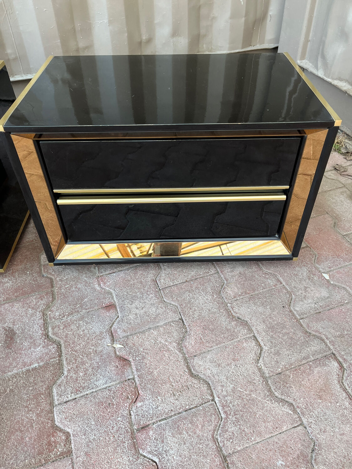 Two lacquered bedside tables.