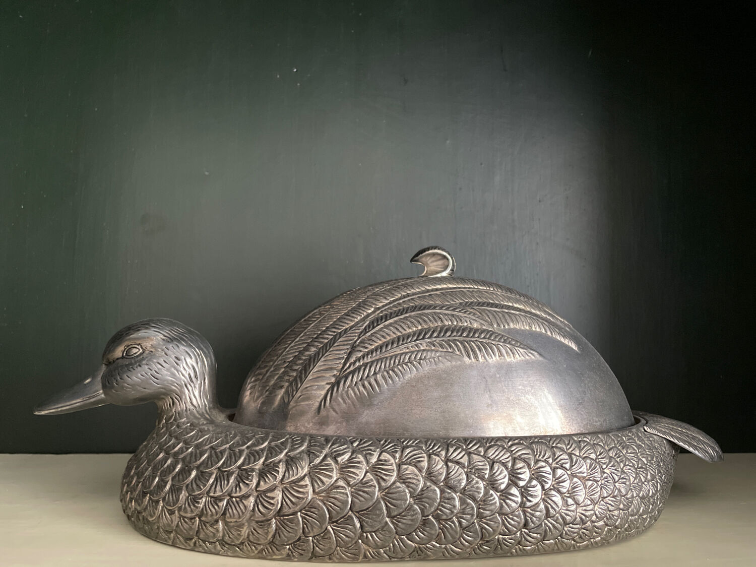 Serving dish with bell in silver metal shape duck